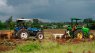 An image of farm equipment working on a farm