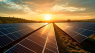 Image of a solar farm at sunset