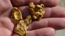 Image of gold nuggets in hand