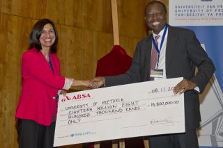 SHOT IN THE ARM University of Pretoria vice chancellor and principal Professor Cheryl de la Rey receives a cheque for the setting up of the new centre from Kumba CEO Norman Mbazima