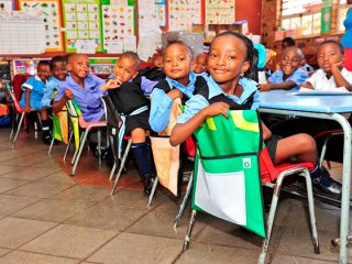 EQUIPPING LEARNERS The vinyl advertising billboards have been converted into pencil cases, chair bags and school backpacks