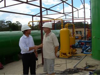 UNIQUE BUSINESS APPROACH Dolphin Bay Chemicals MD Bertus Coetzee hands over a treatment installation plant to First Quantum Minerals forestry manager Guy Havemann 