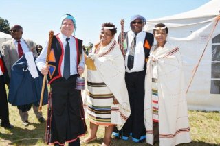 COMMITTED TO COMMUNITYFrom left: AngloGold Ashanti COO Mike O’Hare, Basic Education Minister Angie Motshekga, AngloGold Ashanti sustainability senior VP Simeon Mighty Moloko and Mineral Resources Minister Susan Shabangu were dressed by Lusikisiki villagers in traditional Pondo gear in appreciation of the project