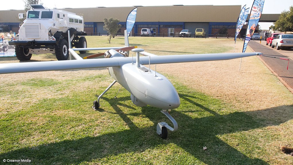 A Denel Dynamics Seeker II unmanned air vehicle on display at the Denel Dynamics facility in Centurion, south of Pretoria. (In the background, a Denel Land Systems Mechem  Casspir mine protected vehicle)