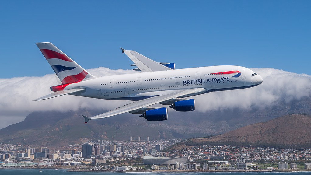 A BA A380 flies past Cape Town and Table Mountain 