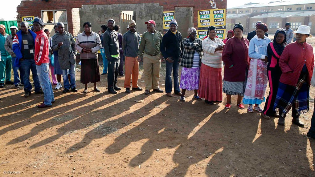 Voters queue to cast their ballots in Bekkersdal, near Johannesburg.