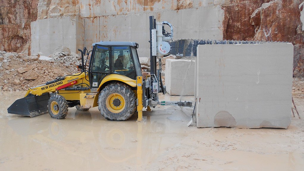 The NCH backhoe cutting marble