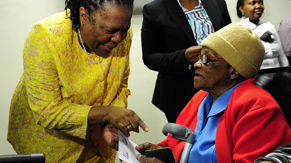 NALEDI PANDOR and ELDERLY CITIZEN The cards are ready to be used in government initiatives, such as the South African Social Security Agency grant payment system and municipal projects, such as housing schemes 