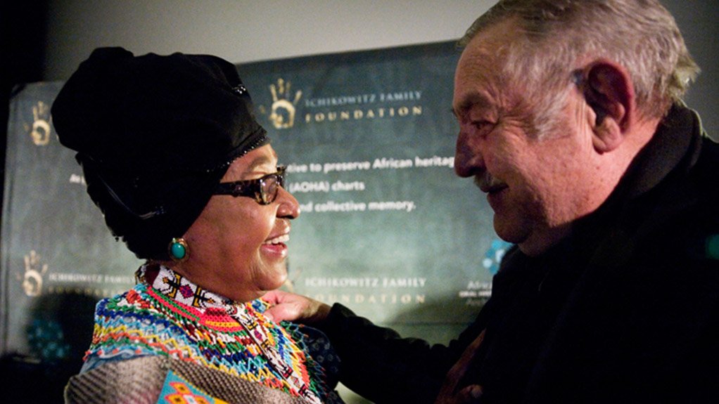 Apartheid era Foreign Minister, Pik Botha gives Winnie Madikizela Mandela a warm embrace at the premier of Plot for Peace in Johannesburg 