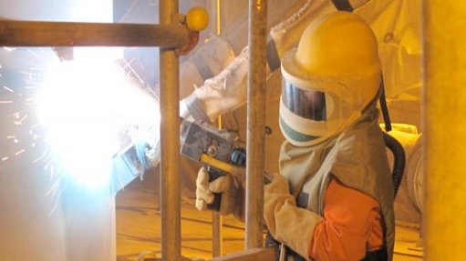 Thermal spray coatings to protect refineries