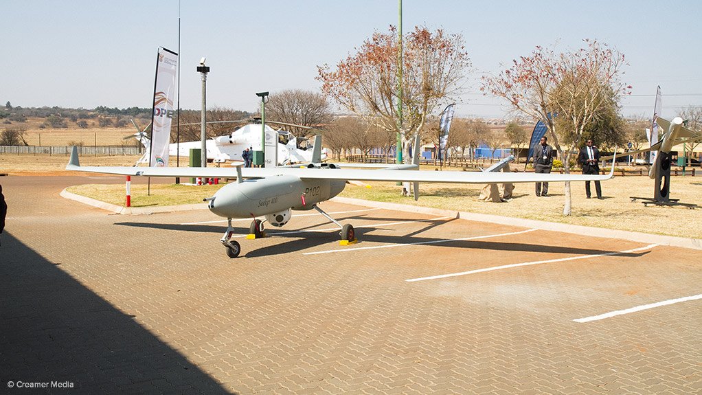 AIMING HIGH A Denel Dynamics Seeker 400 unmanned air vehicle, with a Denel Aviation Rooivalk attack helicopter, in United Nations colours, visible in the background 