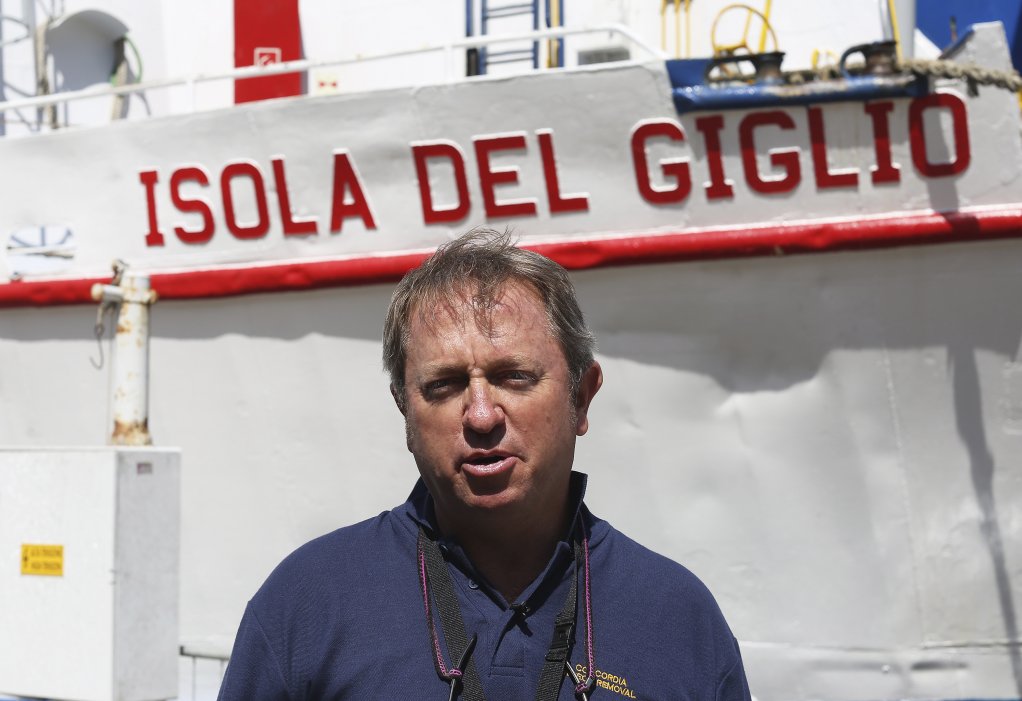 Nick Sloan Salvage master Sloane poses near an Isola del Giglio ferry boat during the refloat operation of the Costa Concordia at Giglio Island in July