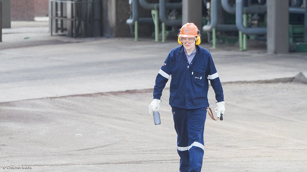 SAMPLING A Sasol worker carries a sample from its Bioworks wastewater treatment plant in Secunda 