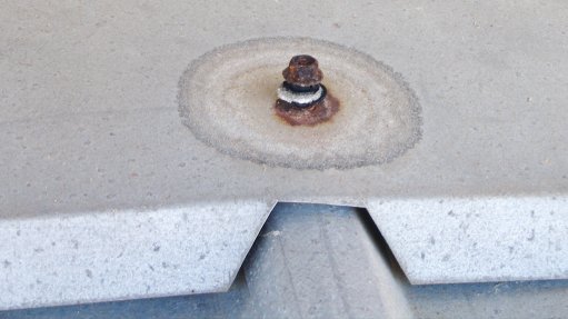 CORRODED FASTENER Fasteners and washers with inferior protective coatings may initially save money, but will ultimately create more maintenance costs 

