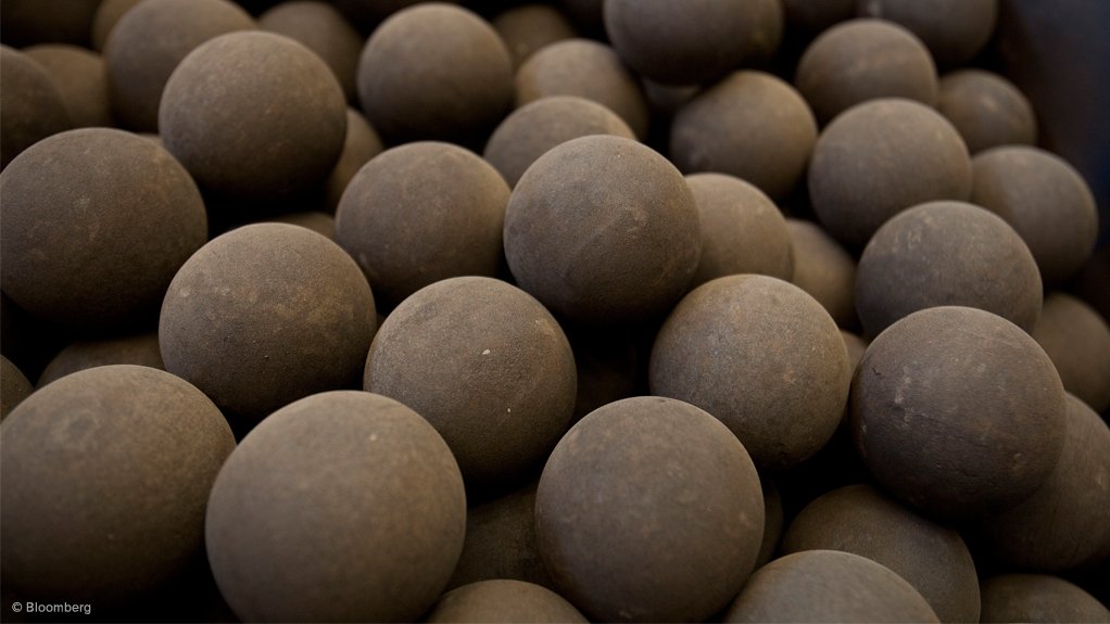 Balls of metal ore sit in a collection drum before loading into a furnace during processing at Katanga Mining's copper and cobalt mine in Kolwezi, Katanga province, Democratic Republic of Congo.