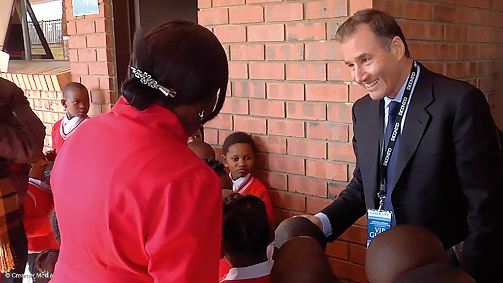 Ivan Glasenberg greeting pupils at the R75-million school Glencore built in the Mpumalanga coalfields