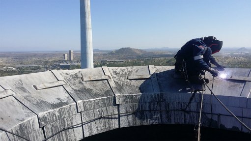 Rope access specialist successfully repairs  stainless steel capping