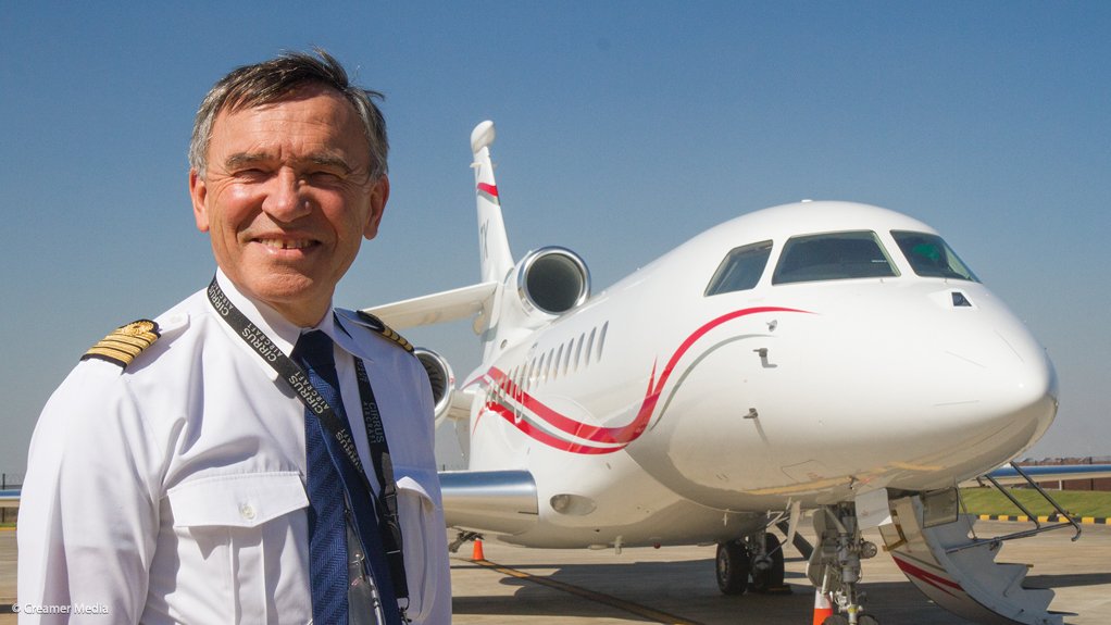 Philippe Rebourg stands in front of the Falcon 7X