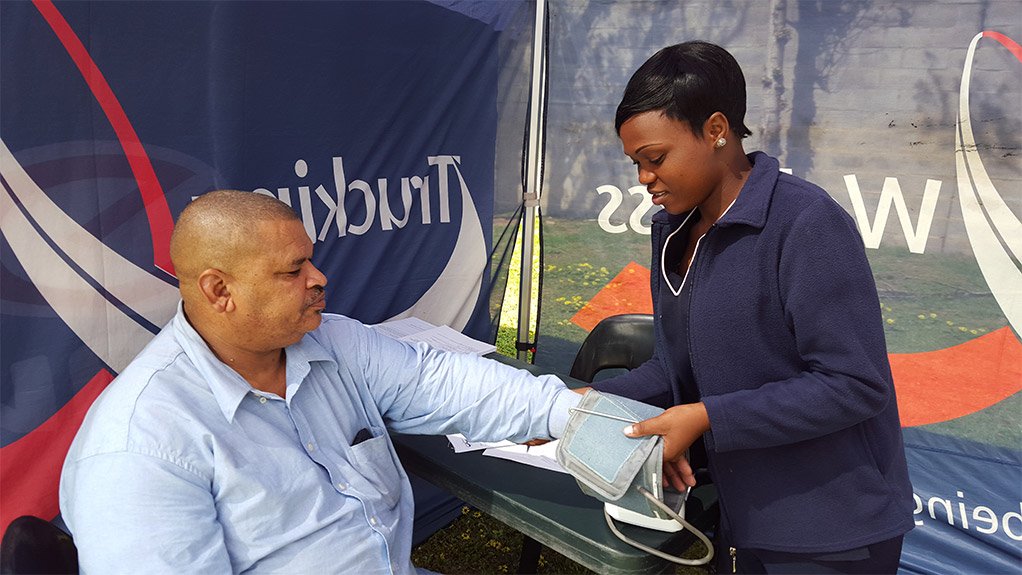 Truck driver Andres Carolissen of Benjanim Gus Services and Talent Xulu (Health Care worker)