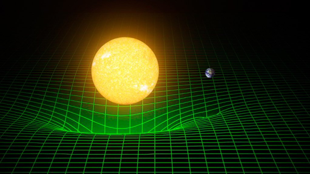A diagram showing how the Sun and Earth warp or bend spacetime (represented by the green grid)