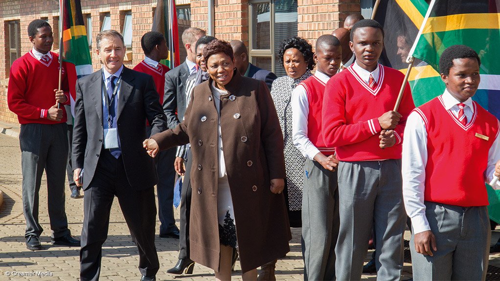 Ivan Glasenberg hand-in-hand with Education Minister Angie Motshekga at school opening.