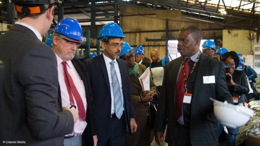 Rob Davies, Ebrahim Patel and Sibusiso Maphatiane on the factory floor at Guestro Casting & Machining