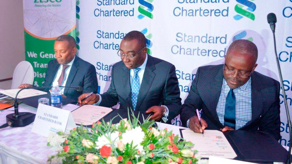 Zesco CEO Victor Mundende, Standard Chartered Bank Zambia CEO Andrew Okai and Zambia’s Deputy Energy Minister Charles Zulu
