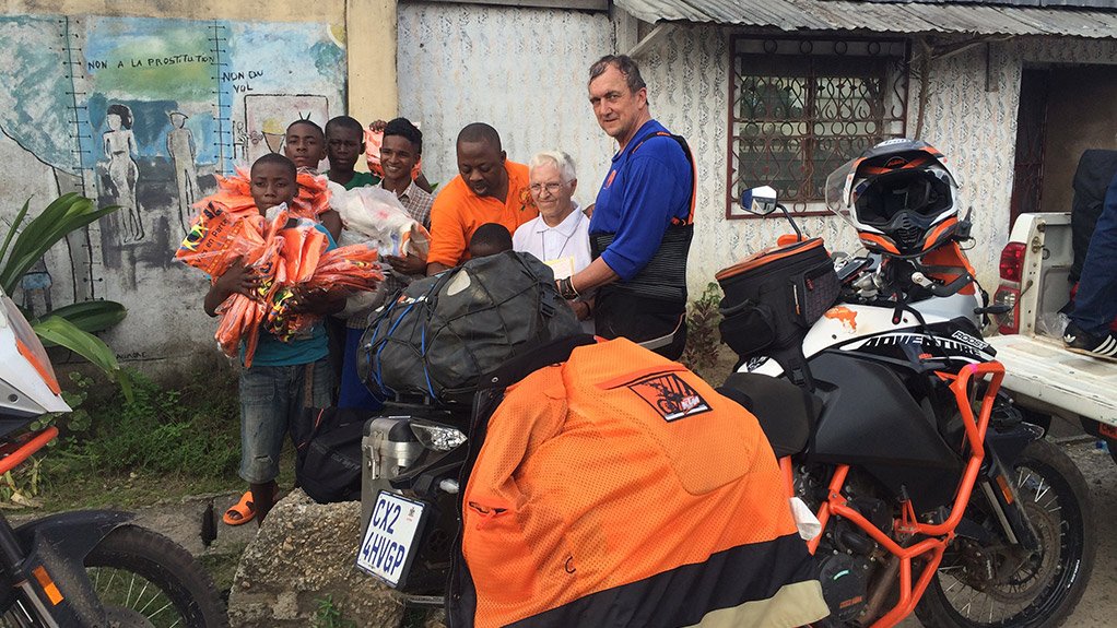 Dr Mark Bristow, right, on his latest bike expedition in Africa.