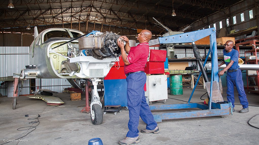 STILL HAND-BUILT Workers building the sixth Falcon 402