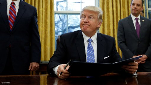 Trump signs new Muslim travel ban excluding Iraq