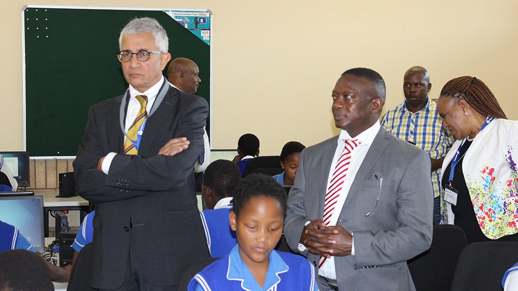 Amplats chairperson Mohammed Valli Moosa and Mineral Resources Deputy Minister Godfrey Oliphant visiting Photsaneng Primary School computer centre

