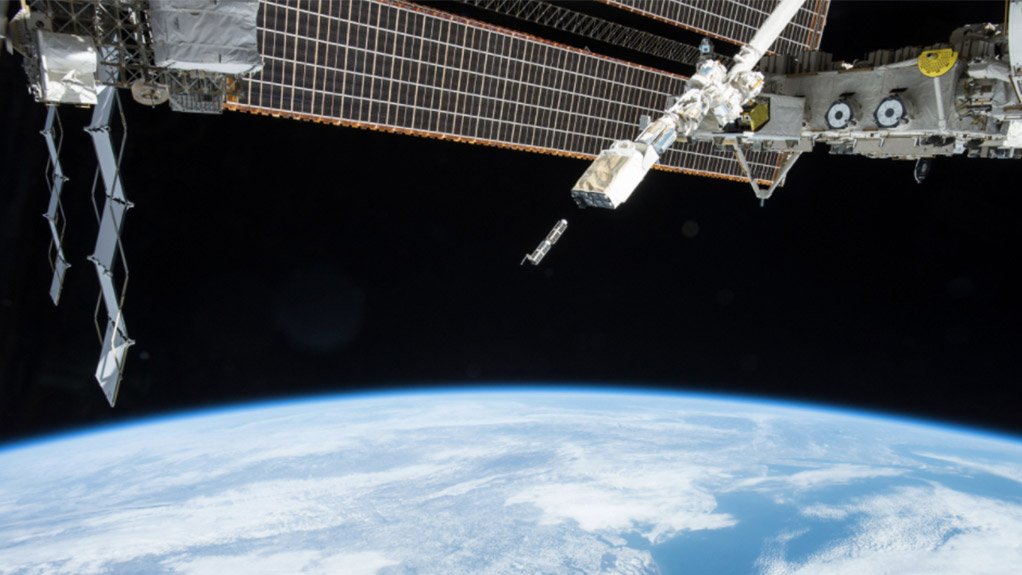 An unidentified nanosatellite is launched from a deployer on the ISS
