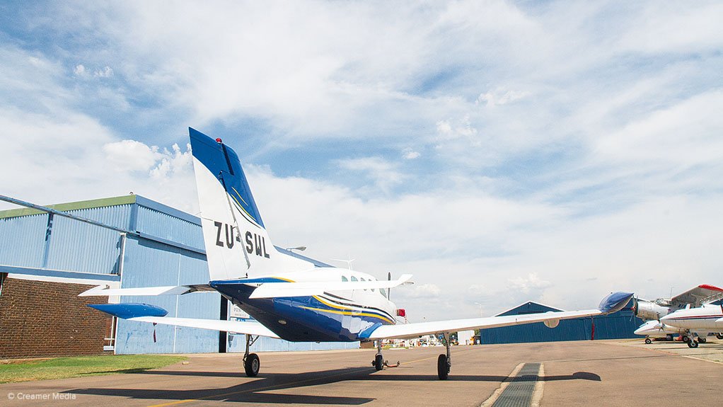 GROWING OVERCAST: The commercial and general aviation sector in South Africa is under pressure. Photo shows a scene at Pretoria’s Wonderboom Airport. (The aircraft in foreground is a locally developed Falcon 402; at the rear, on the right, is an Antonov An-2 biplane)