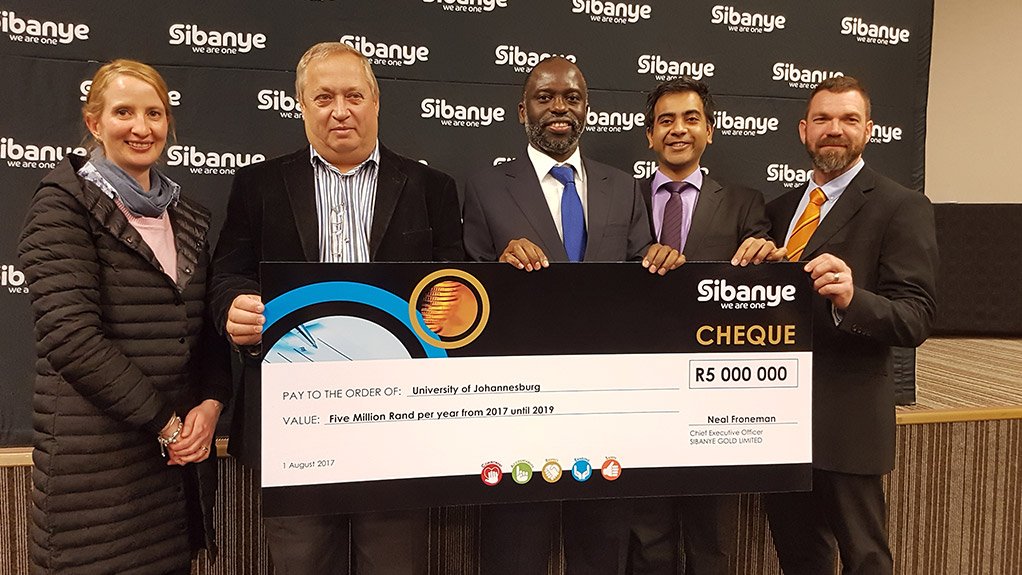 Karen Coetzee, Neal Froneman; Prof Tshilidzi Marwala, Saurabh and Dr Hennie Grobler at the handing over the first of three R5-million cheques to the university
