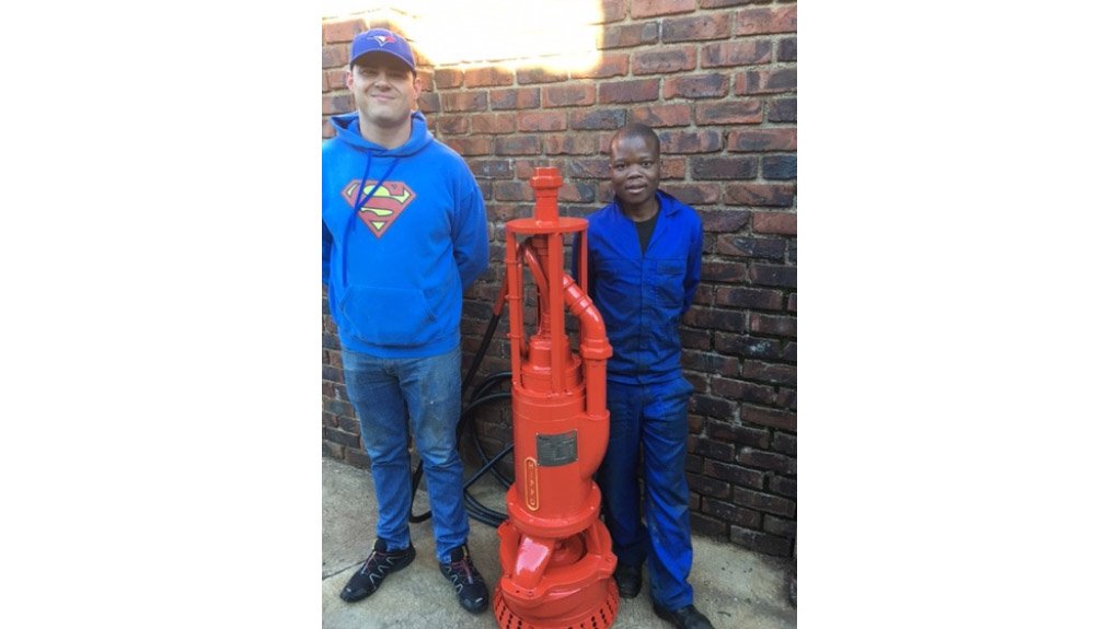 Marius Sunkel and Frans Nkonyane flanking the 75L SBO HIPPO Bottom Suction Flameproof Submersible Slurry Pump