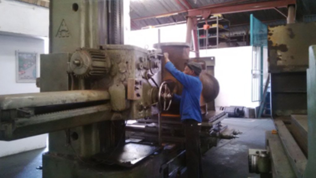 Duplex Stainless Steel Discharge Head being machined in a horizontal 
Boring Mill