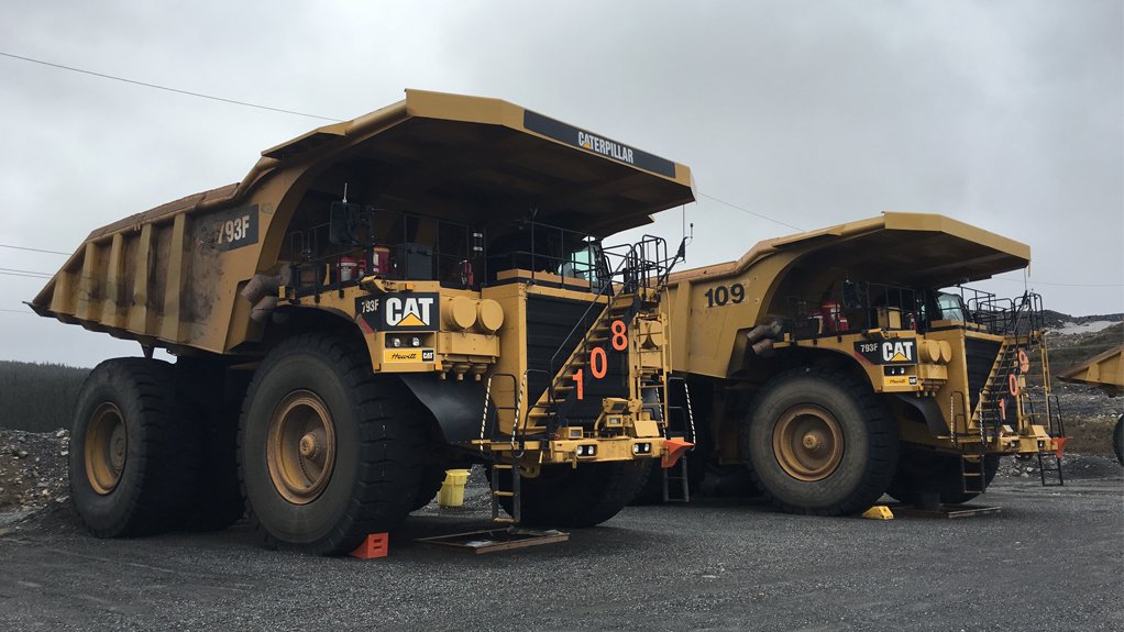 Caterpillar trucks stand at the ready to haul iron-ore at Champion Iron Ore's Bloom Lake mine, Quebec