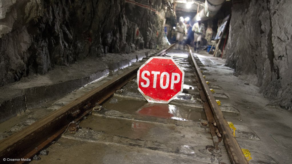 Miner Lonmin narrows first-half loss, cuts annual spending target