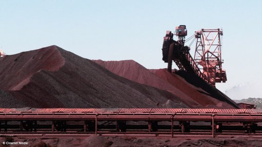 Iron-ore beats back bears as trade fight batters commodities