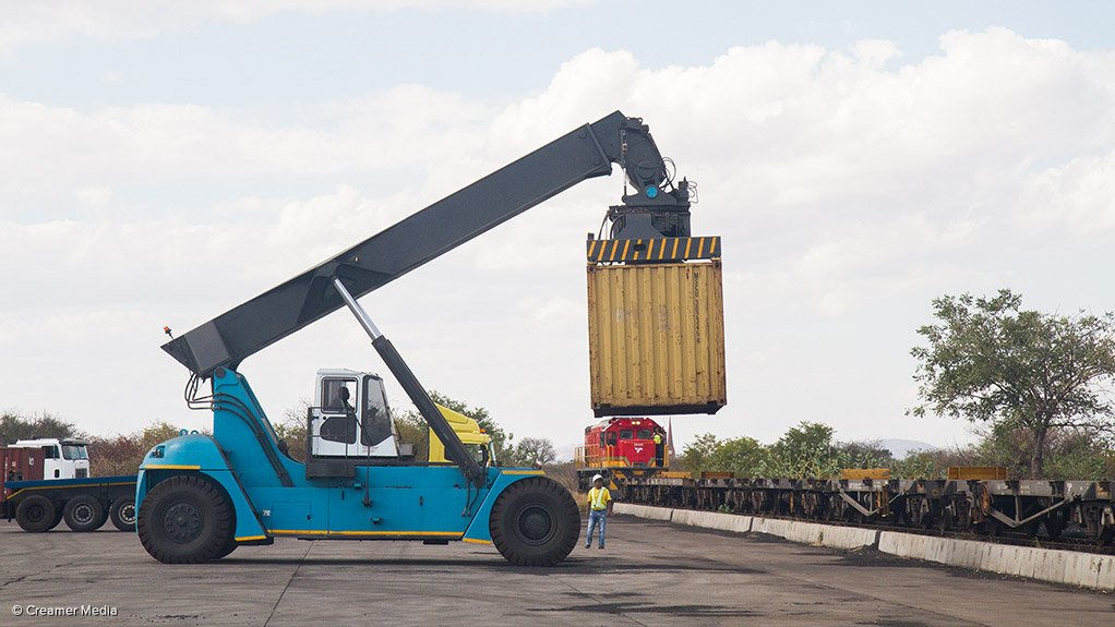 TRADE INFRASTRUCTURE
A reach stacker loads a container onto a waiting train in Musina, South Africa