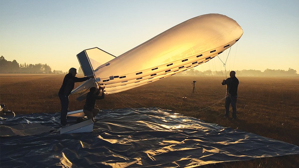  	LIGHTER THAN AIR Readying the aerostat for an early-morning test flight