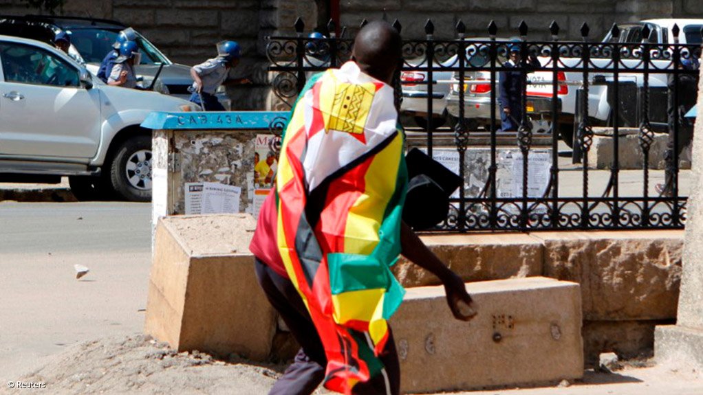 Zimbabwe police ban protests against new tax, citing cholera