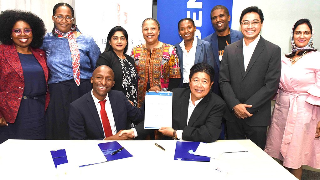 Imbumba Foundation CEO Richard Mabaso and Engen MD & CEO, Yusa' Hassan with partners, senior managers and shareholders, sign off the Caring4Girls Contract
