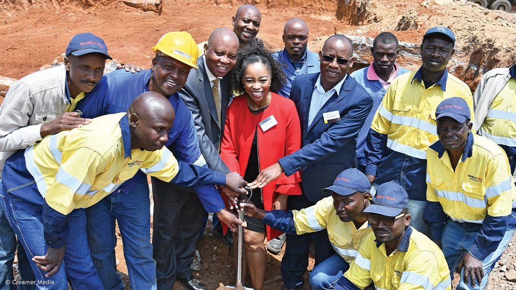 BREAKING GROUND Surrounded by construction workers, CoJ mayor Herman Mashaba (fourth from left), Sigma Capital chairperson Phuti Mahanyele and CoJ Development Planning MMC Reuben Masango at a sod-turning ceremony to mark the beginning of the new development