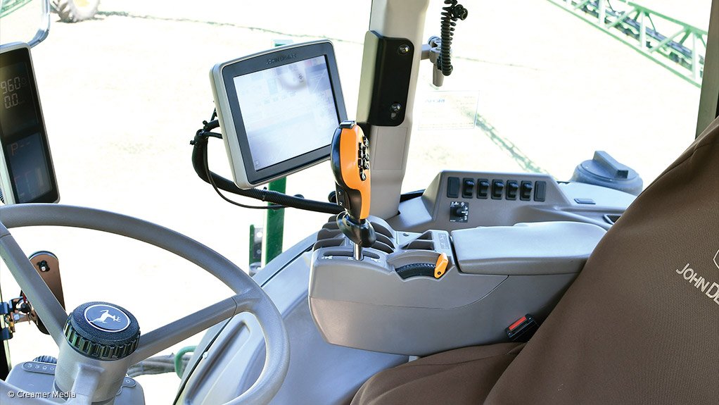 NO HANDS 
John Deere's precision vehicles are self-driven, with an operator only for supervision monitoring