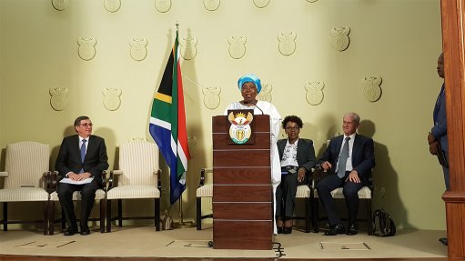 Minister in The Presidency Dr Nkosazana Dlamini-Zuma speaks, while Dr Johan van Zyl, Mpumi Mpofu and Roelf Meyer listen