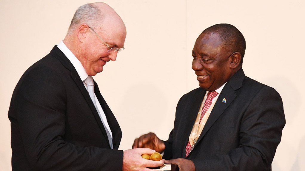 President Cyril Ramaphosa bestows the Order of Ikhamanga in Silver to Jacques Henry Kallis represented by David Rundle
