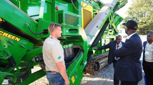 THE DEMO
Exhibitor BL & D Copperbelt demonstrating a screener to  Zambian Mines and Minerals Minister Richard Musukwa
