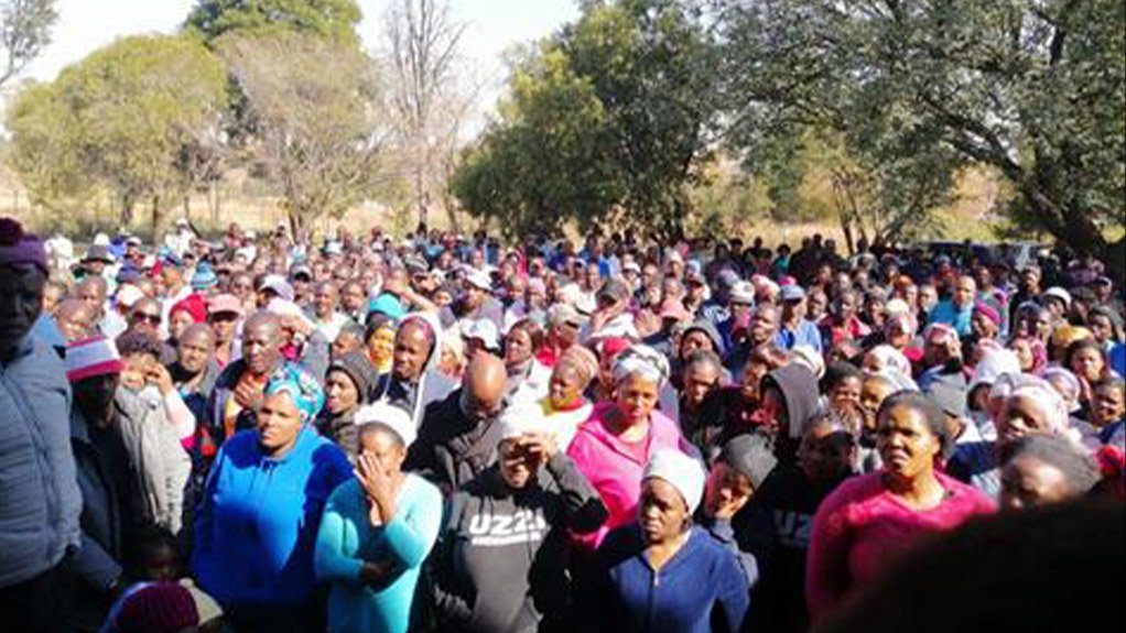 Mass meeting of Blyvooruitzicht community held outside the NG Kerk at Blyvooruitzicht. The community is fighting illegal mining.