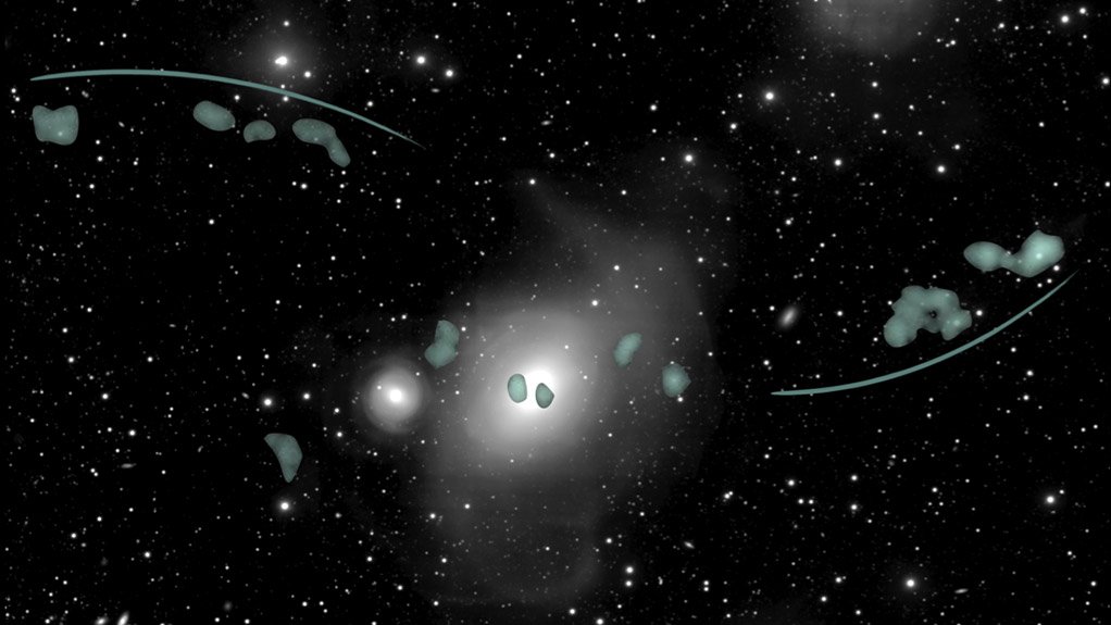 MeerKAT image of NGC 1316/Fornax A (the bright object in the centre of the picture) superimposed on a visual image of the same region from the Italo-Dutch Fornax Deep Survey, showing hydrogen gas concentrations (the green blobs), with the two hydrogen gas tails indicated by the curved lines